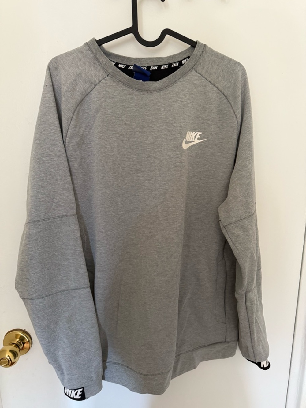 Nike Women's Grey Crewneck Sweatshirt with White Swoosh